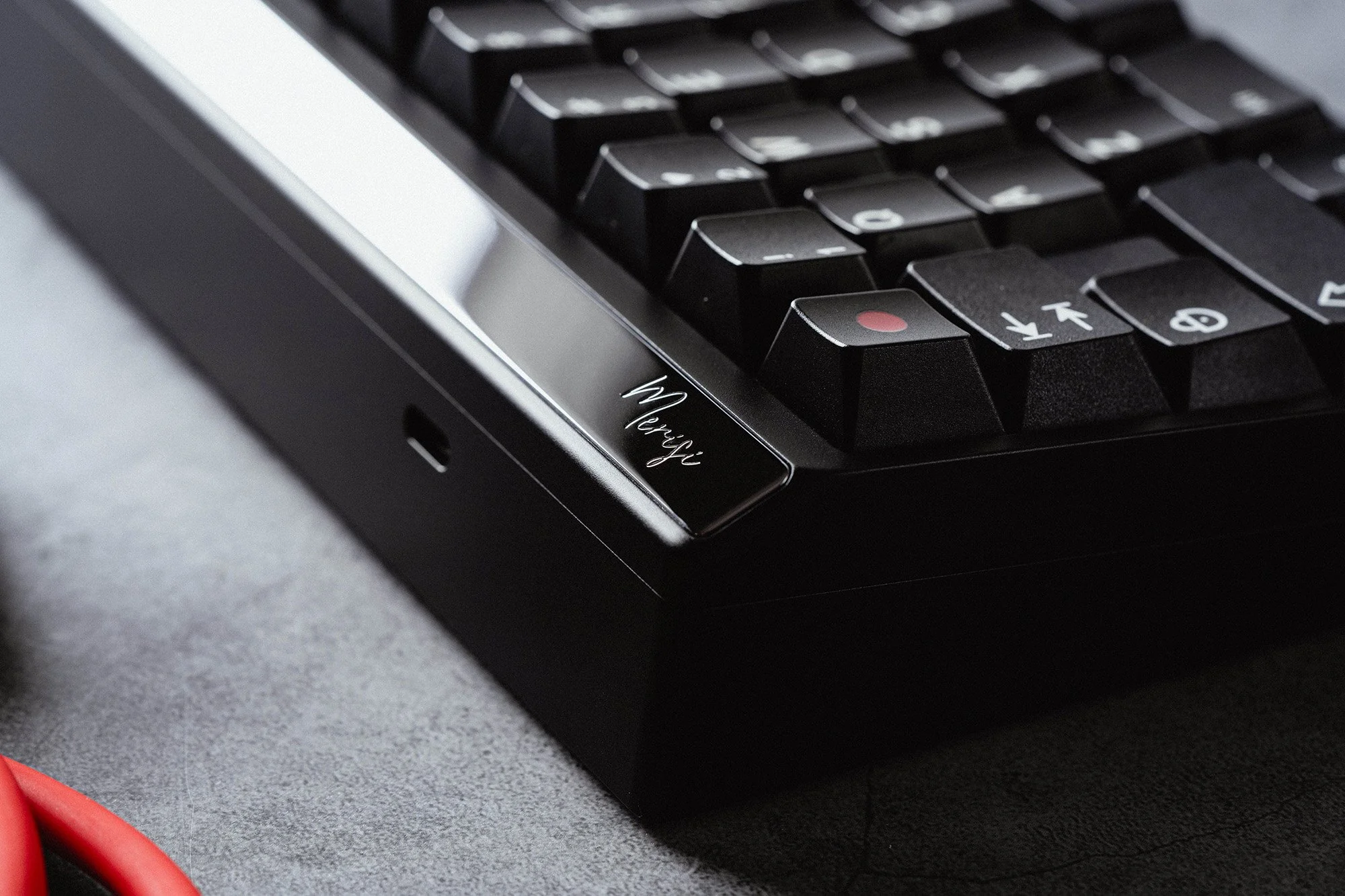Close-up of black keycaps in a metal keyboard case