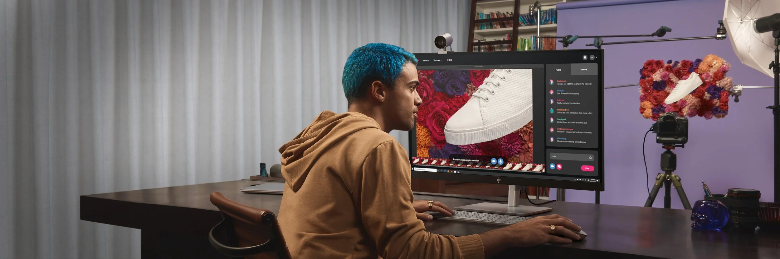 Digital artist compositing a flower on a wide monitor